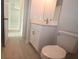 Bathroom with white vanity, mirror and toilet at 36777 Thomas Jefferson Rd, Dade City, FL 33525