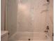 Bathroom features a glass enclosed tub with marble style tile at 36777 Thomas Jefferson Rd, Dade City, FL 33525
