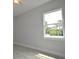 Bedroom with light hardwood style floors and a large window at 36777 Thomas Jefferson Rd, Dade City, FL 33525