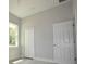 Bedroom with a window and white six panel doors at 36777 Thomas Jefferson Rd, Dade City, FL 33525