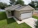 Charming single-Gathering home with a two-car garage, modern siding, and manicured lawn at 36777 Thomas Jefferson Rd, Dade City, FL 33525