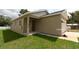 Charming single-story home featuring a modern exterior, well-maintained lawn, and an inviting covered entryway at 36777 Thomas Jefferson Rd, Dade City, FL 33525