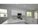 Open kitchen featuring white cabinets, stainless steel appliances, and quartz countertops at 36777 Thomas Jefferson Rd, Dade City, FL 33525