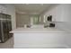 Kitchen features an island, stainless steel appliances, white cabinets and a modern design at 36777 Thomas Jefferson Rd, Dade City, FL 33525