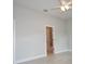 Neutral bedroom with ceiling fan and door to the main bathroom at 36777 Thomas Jefferson Rd, Dade City, FL 33525