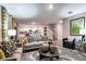 Bright living area with open floor plan, modern furniture, and hardwood floors at 37017 Sagemoor Dr, Zephyrhills, FL 33541