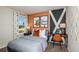 Charming bedroom featuring a cozy bed, a stylish workspace, and plenty of natural light at 37122 Sagemoor Dr, Zephyrhills, FL 33541