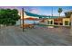 Exterior of a waterfront property with a pool, deck, and lush landscaping at 3912 Doral Dr, Tampa, FL 33634