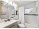 Renovated bathroom featuring a modern vanity, subway tiled shower/tub, and contemporary fixtures at 3912 Doral Dr, Tampa, FL 33634