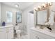 Bright bathroom with modern vanity, fixtures, and tiled floors at 3912 Doral Dr, Tampa, FL 33634