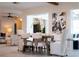 Dining room with a neutral color palette, wood table, and an artistic flair at 3912 Doral Dr, Tampa, FL 33634