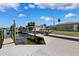 Waterfront property features a private dock, boat lift, and easy access to the open water at 3912 Doral Dr, Tampa, FL 33634