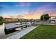 Dock with boat lift on a waterfront home boasts stunning sunset views and easy water access at 3912 Doral Dr, Tampa, FL 33634