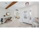 Foyer with beautiful front door, stylish console table, and open sightlines to the living area at 3912 Doral Dr, Tampa, FL 33634