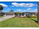 Charming single-story home featuring a well-manicured lawn and inviting curb appeal at 3912 Doral Dr, Tampa, FL 33634