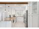 Bright kitchen with granite counters, stainless appliances, white cabinets, and farmhouse sink at 3912 Doral Dr, Tampa, FL 33634
