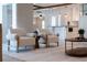 Open living area showcasing modern furniture, stylish decor, and access to kitchen and dining space at 3912 Doral Dr, Tampa, FL 33634