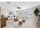 Bright living room with stylish furniture, neutral tones, and large windows with plantation shutters at 3912 Doral Dr, Tampa, FL 33634