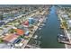 Beautiful waterfront property showcasing backyard canal access, private boat dock, and an inviting screened pool area at 4055 Floramar Ter, New Port Richey, FL 34652