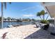 Waterfront backyard with dock and patio furniture for relaxing outdoors at 4055 Floramar Ter, New Port Richey, FL 34652