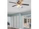 Bedroom features a ceiling fan, three closets, light blue walls, and access to the pool area at 4055 Floramar Ter, New Port Richey, FL 34652
