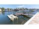 Private boat dock on a calm canal, perfect for boating enthusiasts and waterfront living at 4055 Floramar Ter, New Port Richey, FL 34652