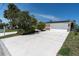 Charming home featuring a well-manicured lawn, spacious driveway, and a two-car garage at 4055 Floramar Ter, New Port Richey, FL 34652