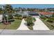Single-story home featuring a lush yard, solar panels, and wide driveway at 4055 Floramar Ter, New Port Richey, FL 34652