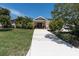 Charming home with a well-manicured lawn and decorative front door at 4055 Floramar Ter, New Port Richey, FL 34652