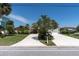 Charming home with a well-kept lawn and an inviting driveway, showcasing curb appeal at 4055 Floramar Ter, New Port Richey, FL 34652