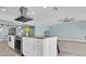 Island kitchen with granite countertop, stainless appliances, ample storage, and recessed lighting at 4055 Floramar Ter, New Port Richey, FL 34652
