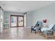 Bright room with tiled floor, barn door, and neutral paint at 4055 Floramar Ter, New Port Richey, FL 34652