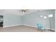 Living room featuring laminated floors, neutral paint, and waterfront views at 4055 Floramar Ter, New Port Richey, FL 34652