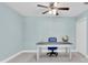 Bright office with built-in storage, neutral color scheme, and ceiling fan at 4055 Floramar Ter, New Port Richey, FL 34652