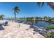 Beautiful patio overlooking a serene canal, perfect for relaxing and enjoying waterfront living at 4055 Floramar Ter, New Port Richey, FL 34652