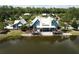 Community clubhouse overlooking the lake, featuring a patio and seating area at 4093 Epic Cv, Land O Lakes, FL 34638
