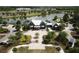Community clubhouse with lake view, patio and manicured landscaping at 4093 Epic Cv, Land O Lakes, FL 34638