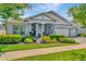 Charming one-story home with lush landscaping, manicured lawn, and a three car garage at 4093 Epic Cv, Land O Lakes, FL 34638