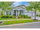 Charming one-story home with lush landscaping, manicured lawn, and a three car garage at 4093 Epic Cv, Land O Lakes, FL 34638