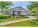 Charming one-story home with lush landscaping, manicured lawn, and a three car garage at 4093 Epic Cv, Land O Lakes, FL 34638