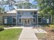 Community fitness center featuring a modern blue exterior, inviting entrance, and well-maintained landscaping at 4093 Epic Cv, Land O Lakes, FL 34638