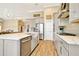 Spacious kitchen with a large center island, stainless appliances, light gray cabinets, and an open layout at 4093 Epic Cv, Land O Lakes, FL 34638