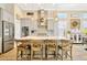 Bright, spacious kitchen with large center island, pendant lighting, and stainless steel appliances at 4093 Epic Cv, Land O Lakes, FL 34638