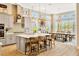 Bright, spacious kitchen with large center island, pendant lighting, and dining area at 4093 Epic Cv, Land O Lakes, FL 34638