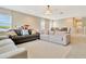 Well-lit living room with comfortable seating, an open floor plan, and plenty of natural light, creating a relaxing atmosphere at 4093 Epic Cv, Land O Lakes, FL 34638