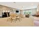 Spacious living room with a stylish dining area, comfortable seating, and entertainment center for Gathering gatherings at 4093 Epic Cv, Land O Lakes, FL 34638