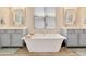 Contemporary main bathroom featuring double sinks and a luxurious soaking tub at 4093 Epic Cv, Land O Lakes, FL 34638