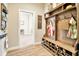 Mudroom with built in storage and wood look tile flooring at 4093 Epic Cv, Land O Lakes, FL 34638