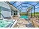 Screened lanai with a pool, spa, and outdoor seating area perfect for entertaining and relaxation at 4093 Epic Cv, Land O Lakes, FL 34638