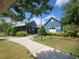 Community recreation area offering a swim club and game room, complemented by lush landscaping and scenic pathways at 4093 Epic Cv, Land O Lakes, FL 34638